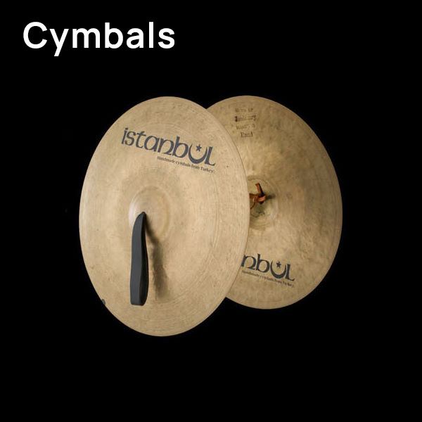 Pair of Istanbul brand Turkish cymbals (Beckena due, piatti, cymbales) for musical instruments, on a black background.