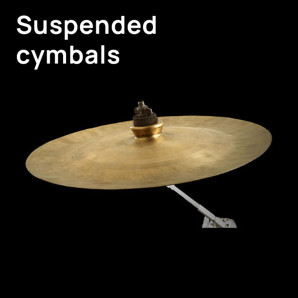 Suspended cymbal close-up, brass musical instrument on a stand, drum set percussion component against a black background