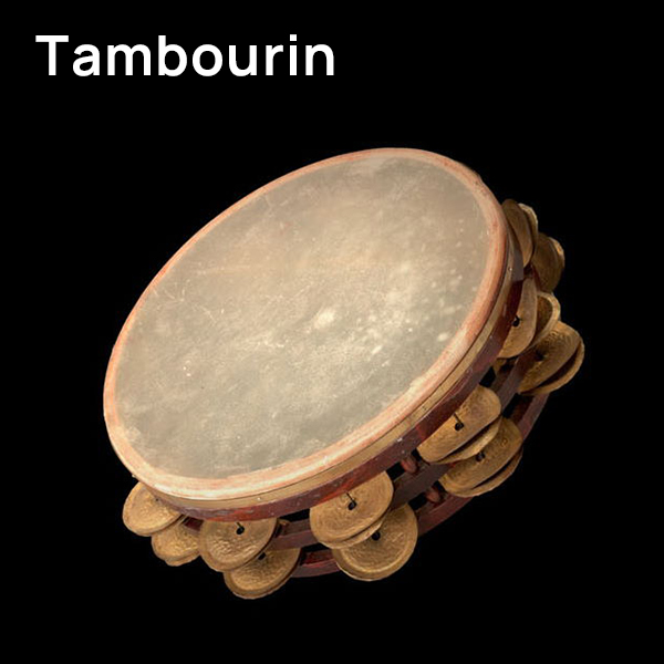 A brown tambourine, also known as a Schellentrommel or Basque drum, with a light-colored drumhead and brass jingles against a black background.