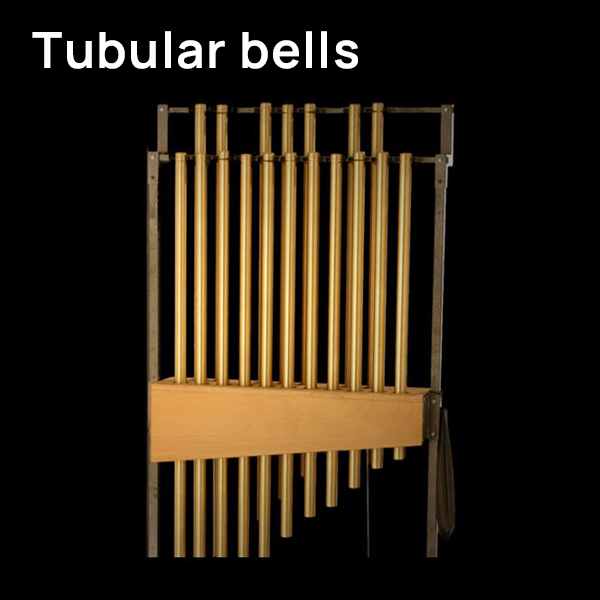 Musical instrument tubular bells with brass tubes on a dark background.