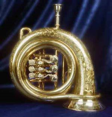 Ornately engraved golden Wiener Horn or Viennese horn, a brass instrument.