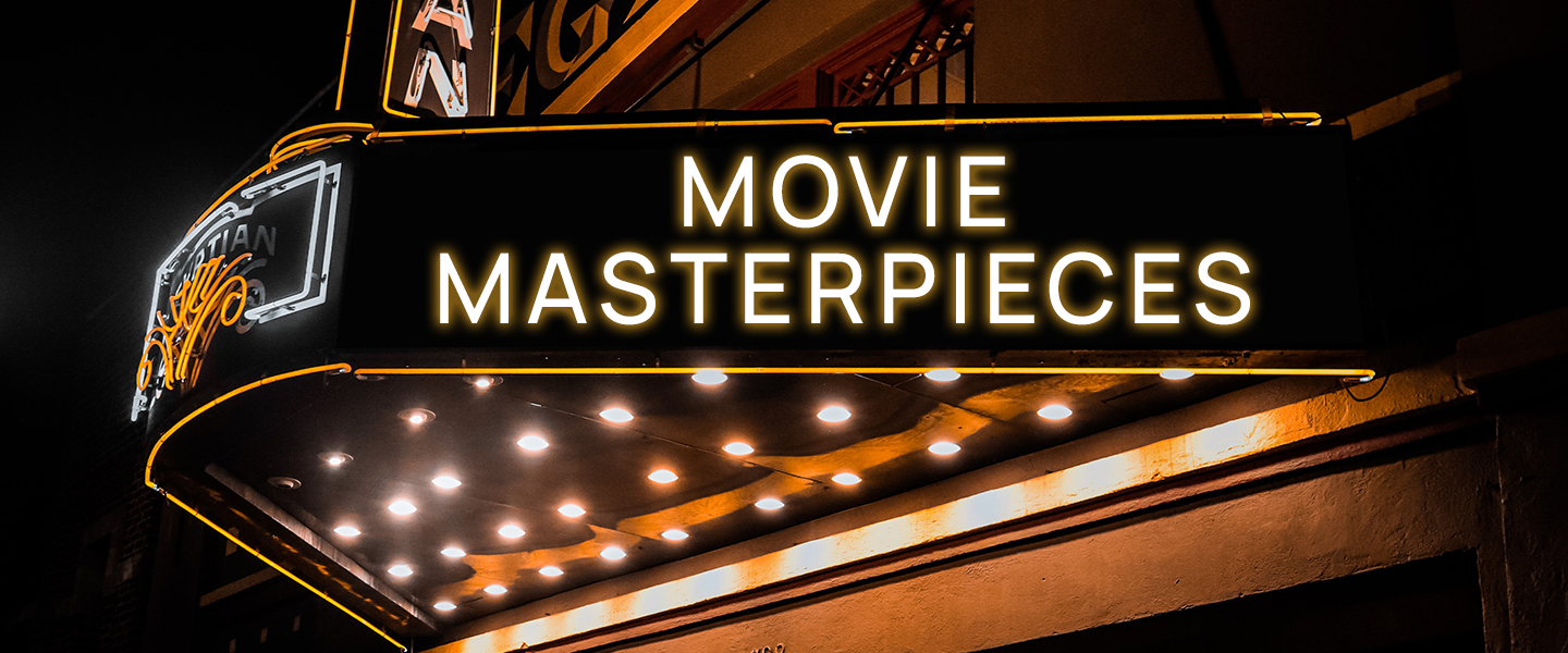 Movie theater marquee at night with glowing neon sign advertising MOVIE MASTERPIECES in white letters.