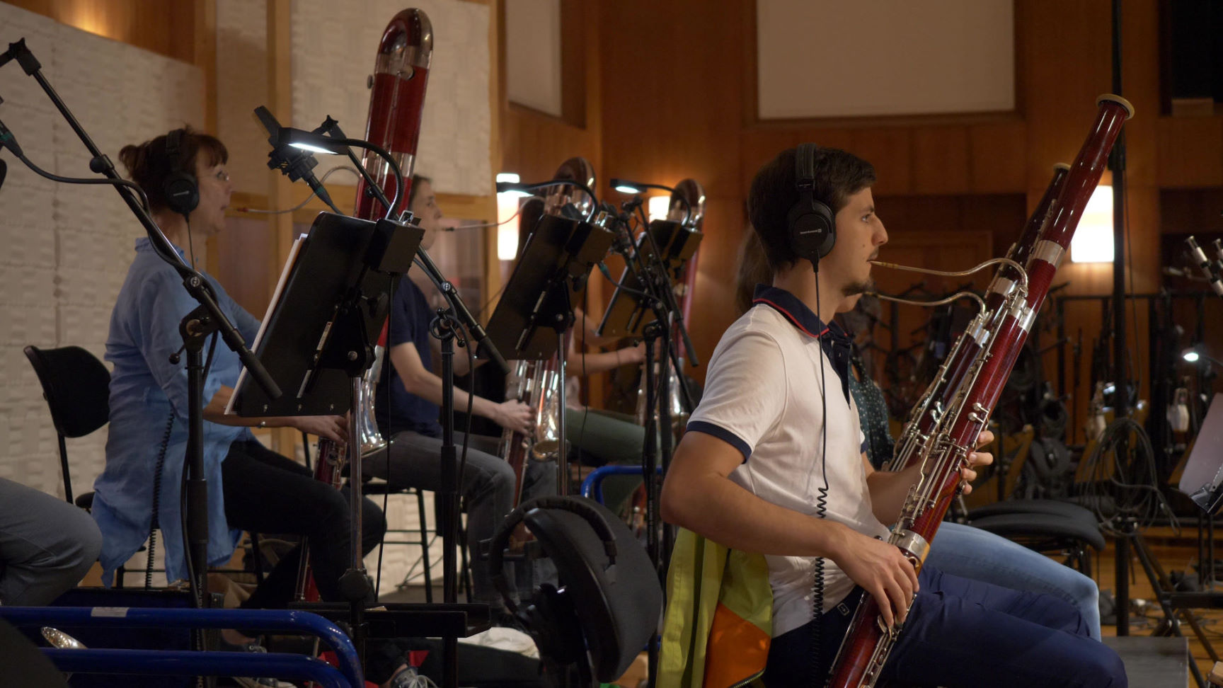 Children's choir recording Big Bang Orchestra: Ymir at Vienna Symphonic Library Synchron Stage, with conductor direction and music stands.