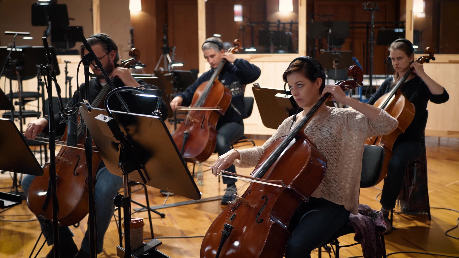 Children's choir recording Big Bang Orchestra: Ymir at Vienna Symphonic Library Synchron Stage, with conductor direction and music stands.