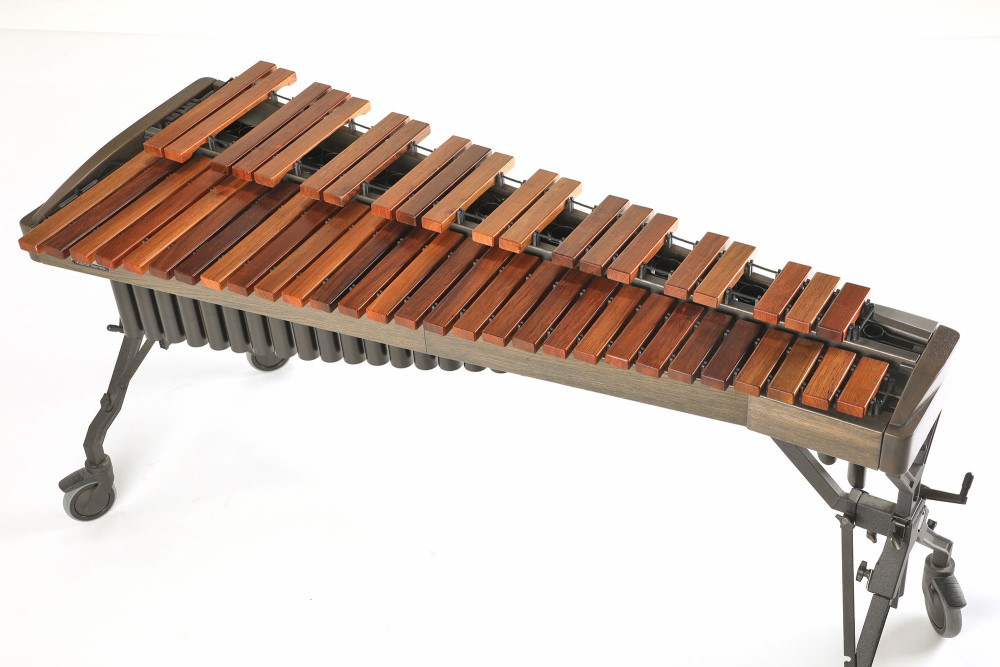 Marimba with wooden bars, metal resonators, and a dark frame on wheels, part of the Vienna Symphonic Library Synchron Percussion I series.