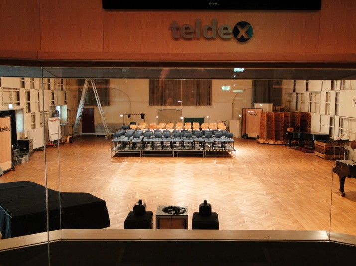 Overhead view of a virtual concert hall showing MIRx Mode instrument placement, with orange circles for horns and brass, and Wagner tuba and piccolo trumpet labels visible, demonstrating Vienna MIR Pro's spatial audio settings.
