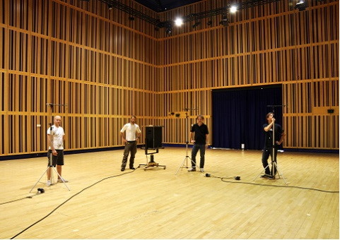 Overhead view of a virtual concert hall showing MIRx Mode instrument placement, with orange circles for horns and brass, and Wagner tuba and piccolo trumpet labels visible, demonstrating Vienna MIR Pro's spatial audio settings.