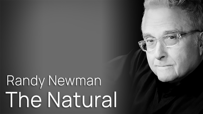 Black and white portrait of Randy Newman, seen from the chest up, wearing glasses, with the text Randy Newman The Natural on the left side.