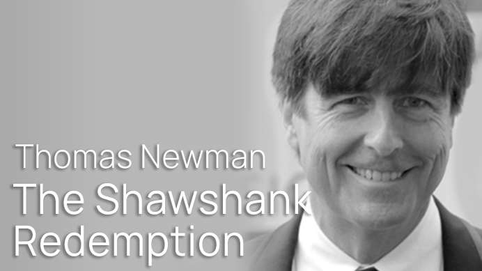 Black and white headshot of Thomas Newman, composer for The Shawshank Redemption, smiling.
