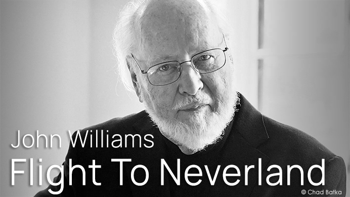Black and white close-up of composer John Williams looking forward, with text overlay John Williams Flight To Neverland.
