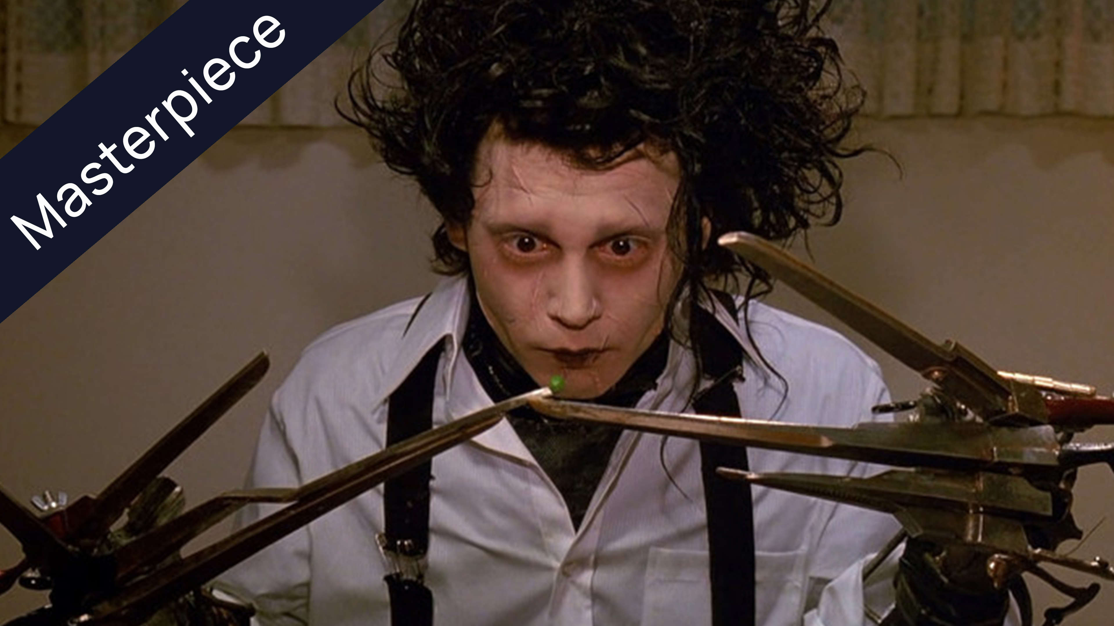 Edward Scissorhands attempting to eat a pea with his scissor hands, a classic movie scene with a Masterpiece banner.