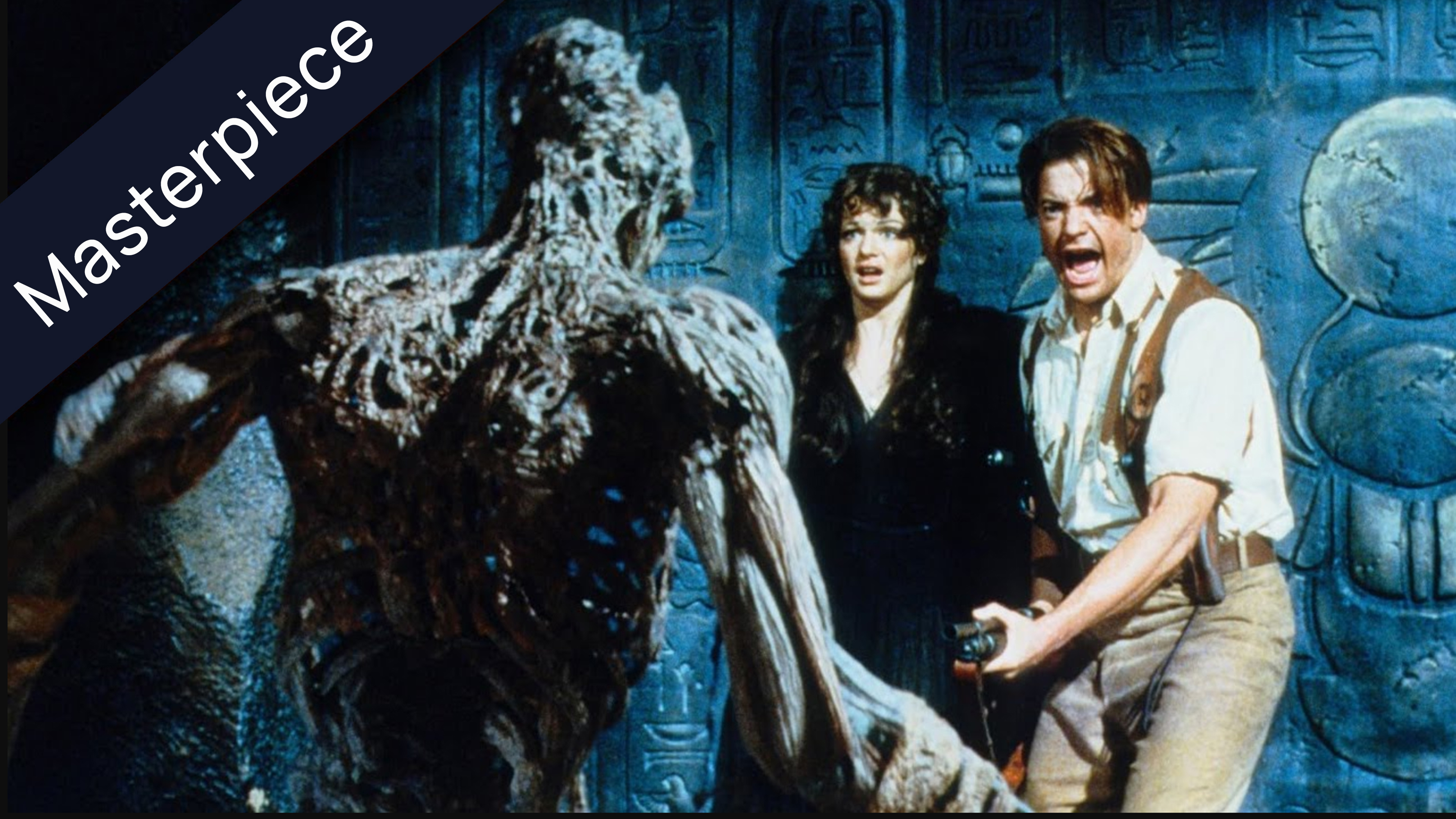 Still from The Mummy (1999) featuring a terrifying, decaying mummy monster facing a terrified Evie Carnahan and Rick O'Connell, who screams in terror, holding a shotgun.