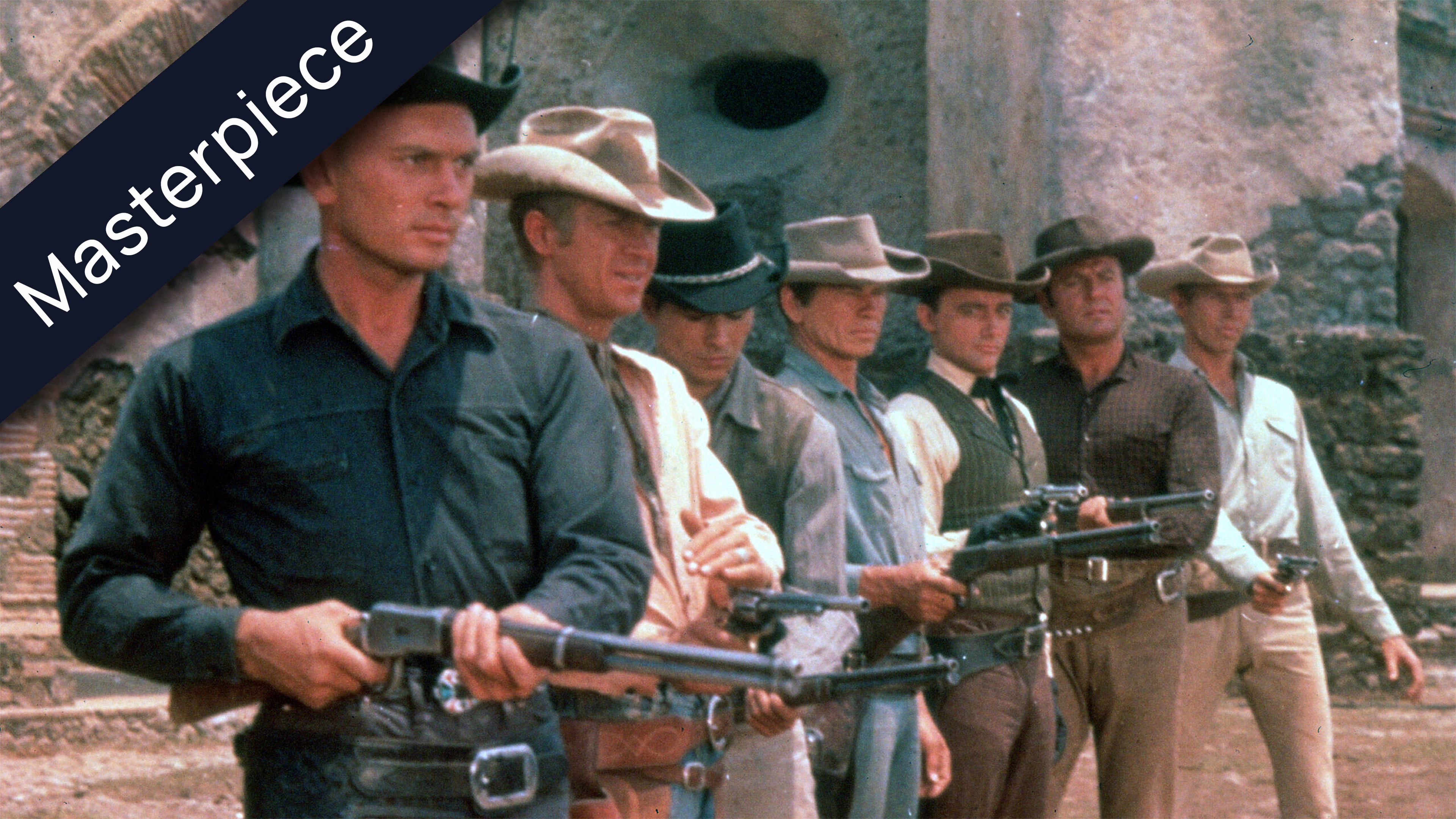 A group of seven cowboys or western movie characters, including Steve McQueen and Charles Bronson, wearing hats and holding rifles, standing in a line. A dark blue banner with the word Masterpiece diagonally crosses the top left corner of the image.