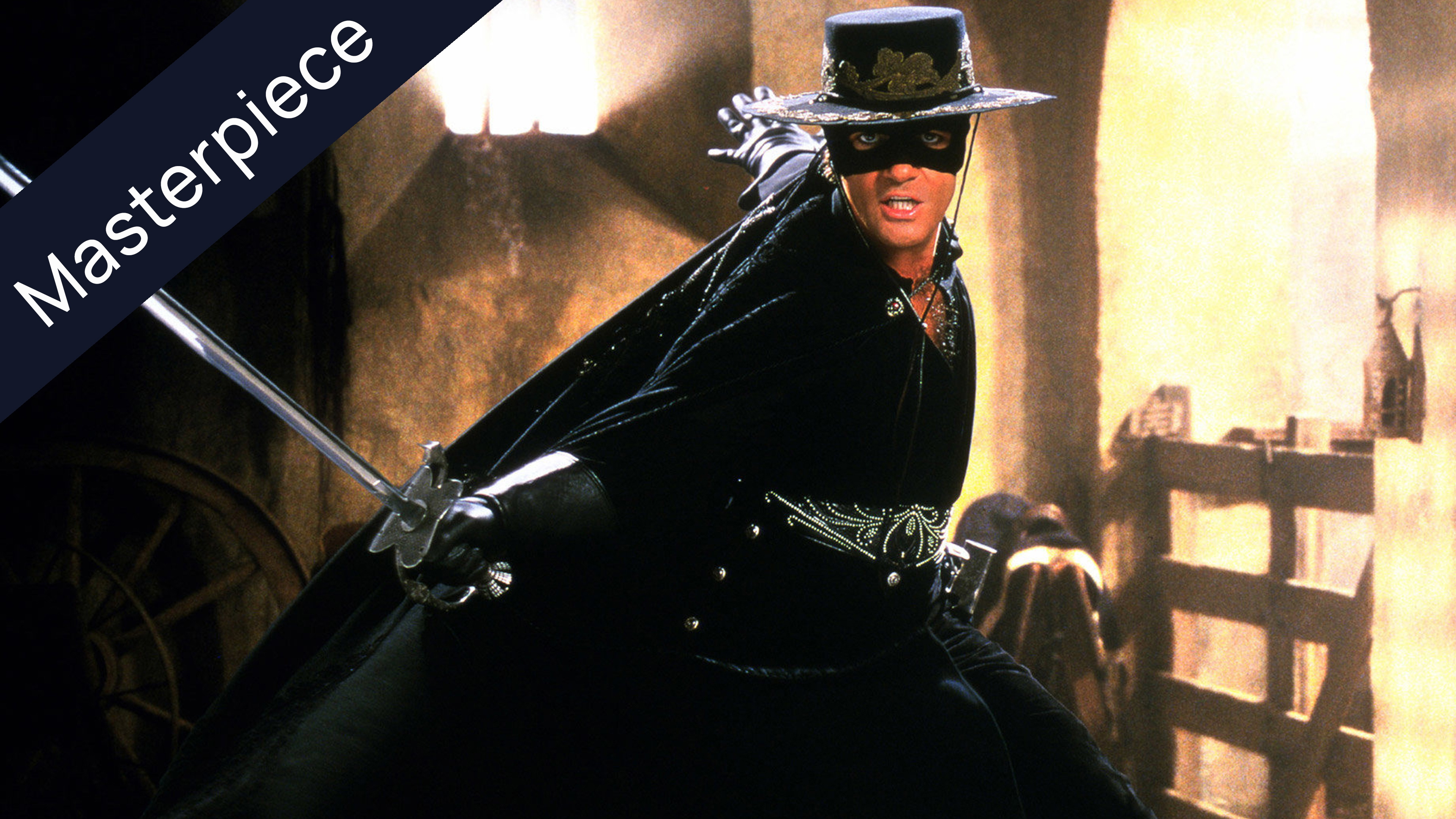 Antonio Banderas as Zorro, masked and in black attire, wielding a sword, with a Masterpiece banner.