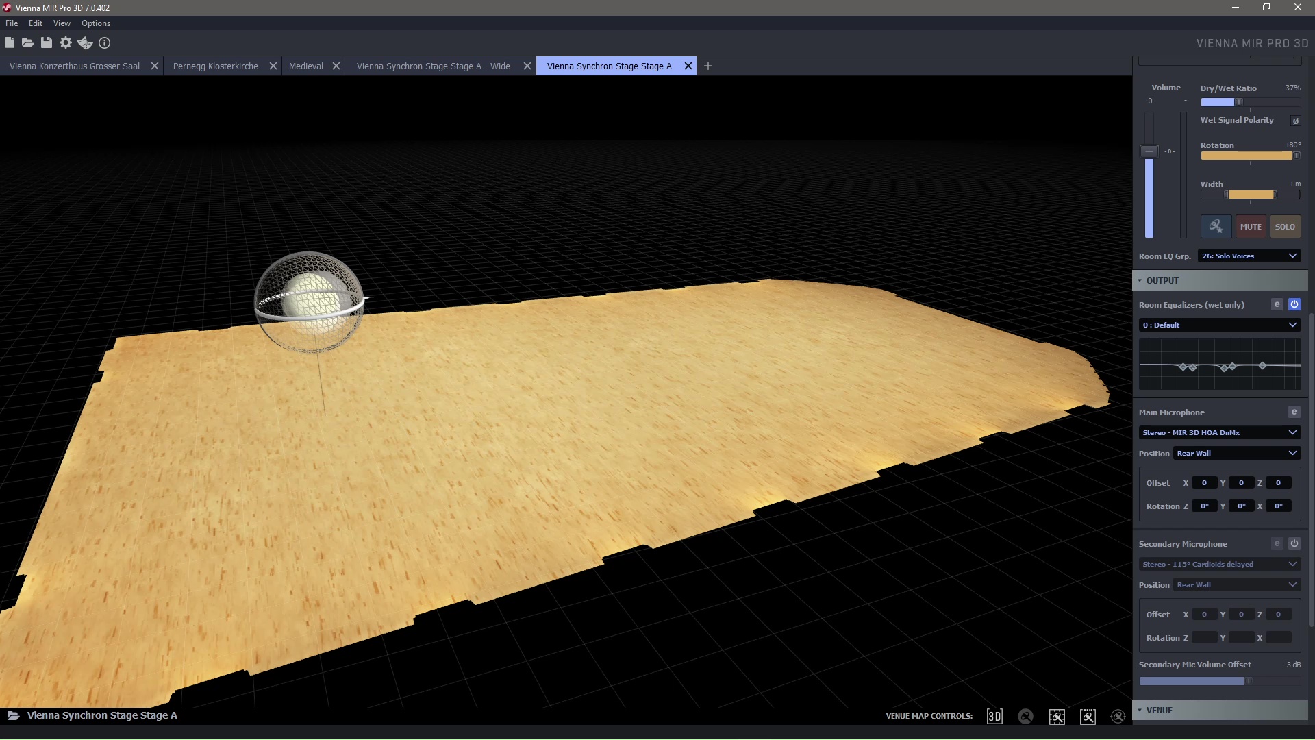 Vienna MIR Pro 3D software interface with a 3D rendering of a wooden stage in a virtual acoustic space, displaying audio output settings and microphone controls.