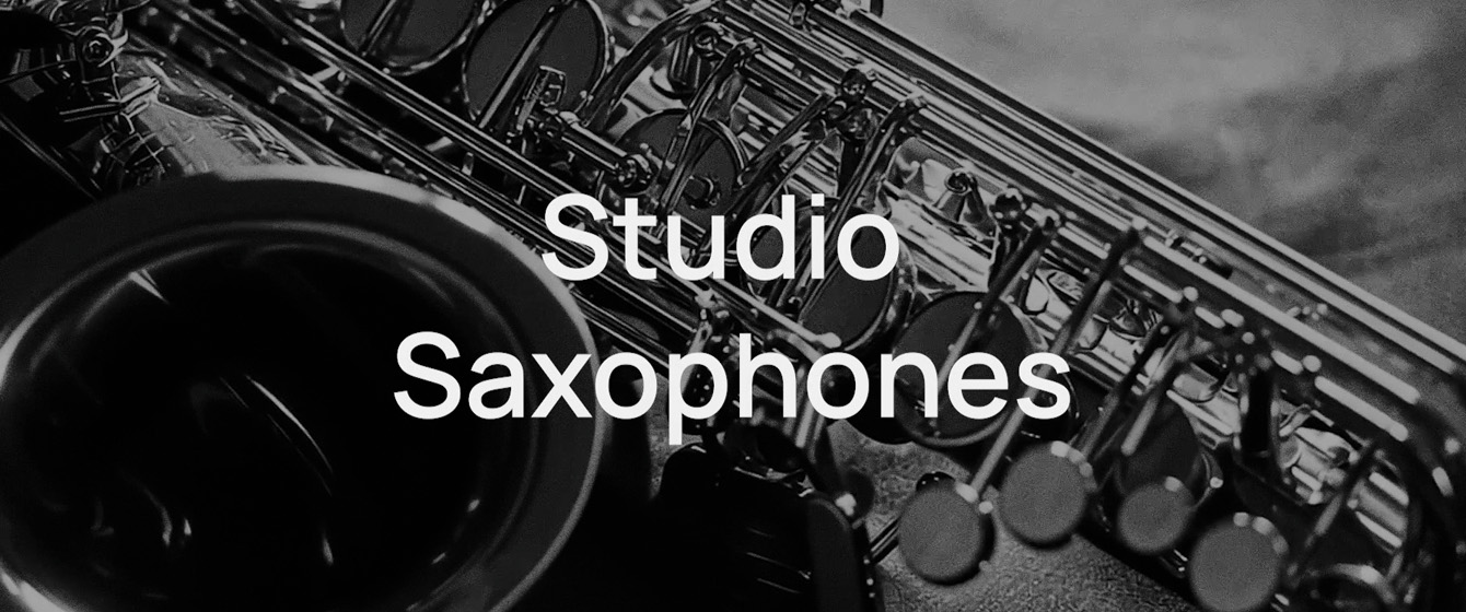 Black and white image of a shiny saxophone with the words Studio Saxophones overlaid in white, promoting musical instruments and professional audio equipment.