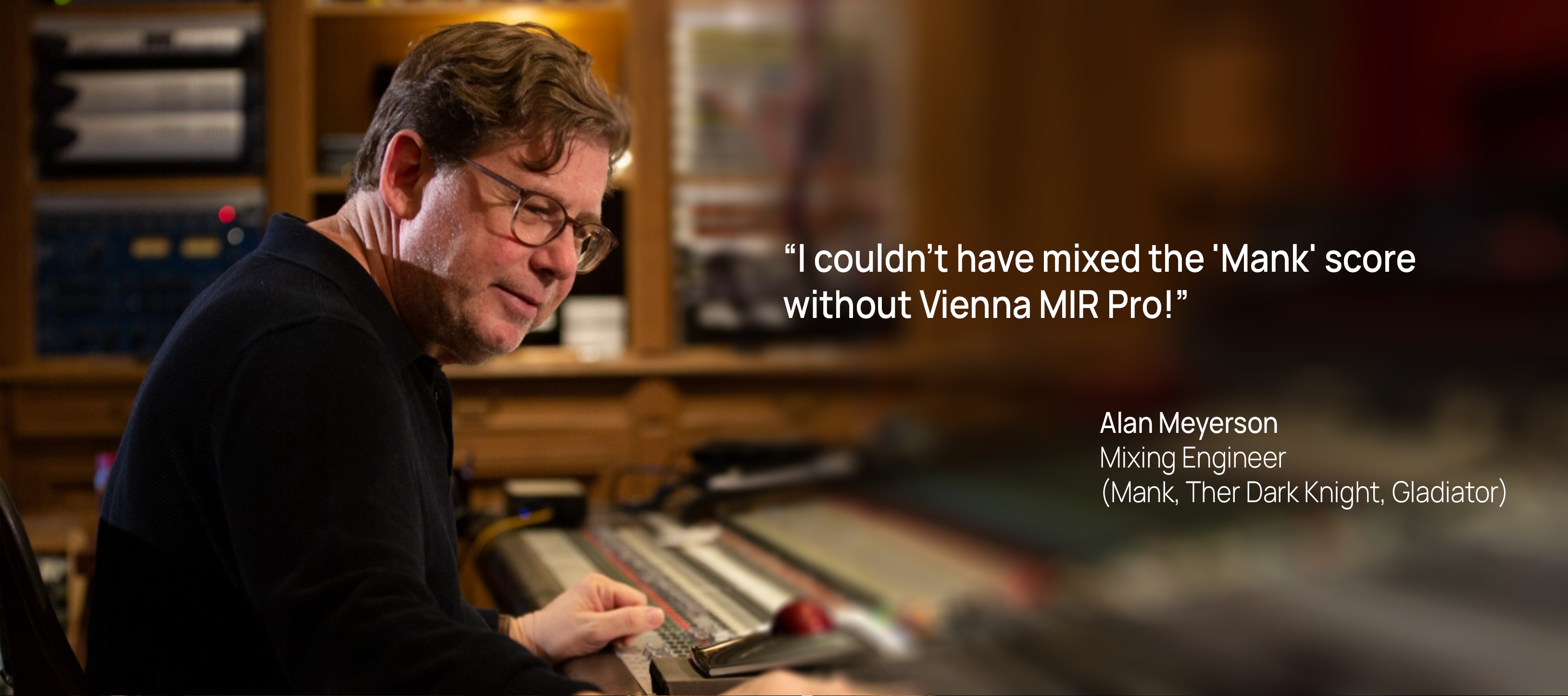 Alan Meyerson, Mixing Engineer for Mank, The Dark Knight, and Gladiator, at a sound mixing board.